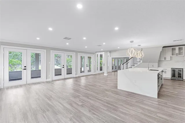 a spacious bathroom with a tub sink shower and mirror