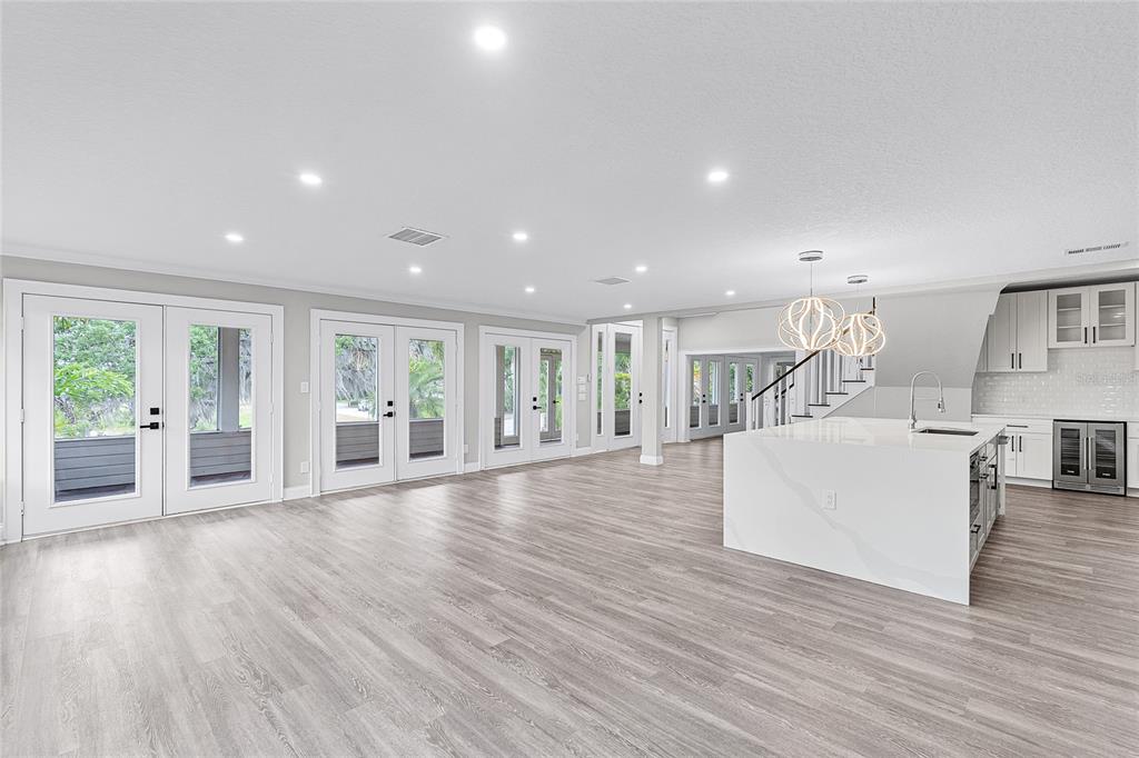 311 East 8th Avenue Windermere, FL 34786 - Photo 17 of 59 a view of kitchen with furniture and wooden floor