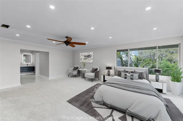 a view of a livingroom with furniture and hardwood floor