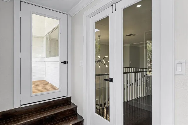 a white toilet sitting next to a shower