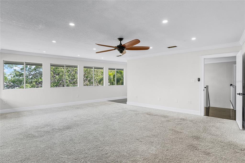 311 East 8th Avenue Windermere, FL 34786 - Photo 26 of 59 an empty room with a ceiling fan and window