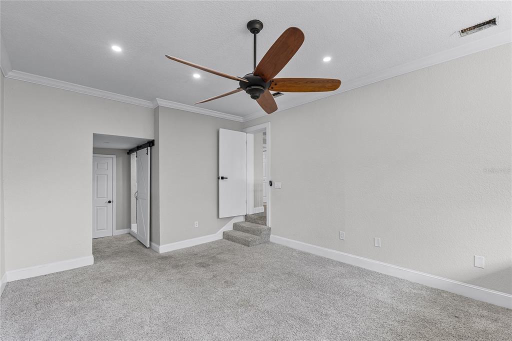 311 East 8th Avenue Windermere, FL 34786 - Photo 35 of 59 a view of a room with a ceiling fan and a ceiling fan
