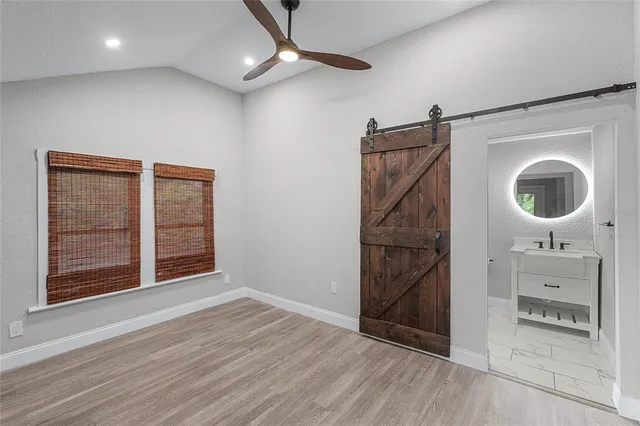 a view of gallery with wooden floor