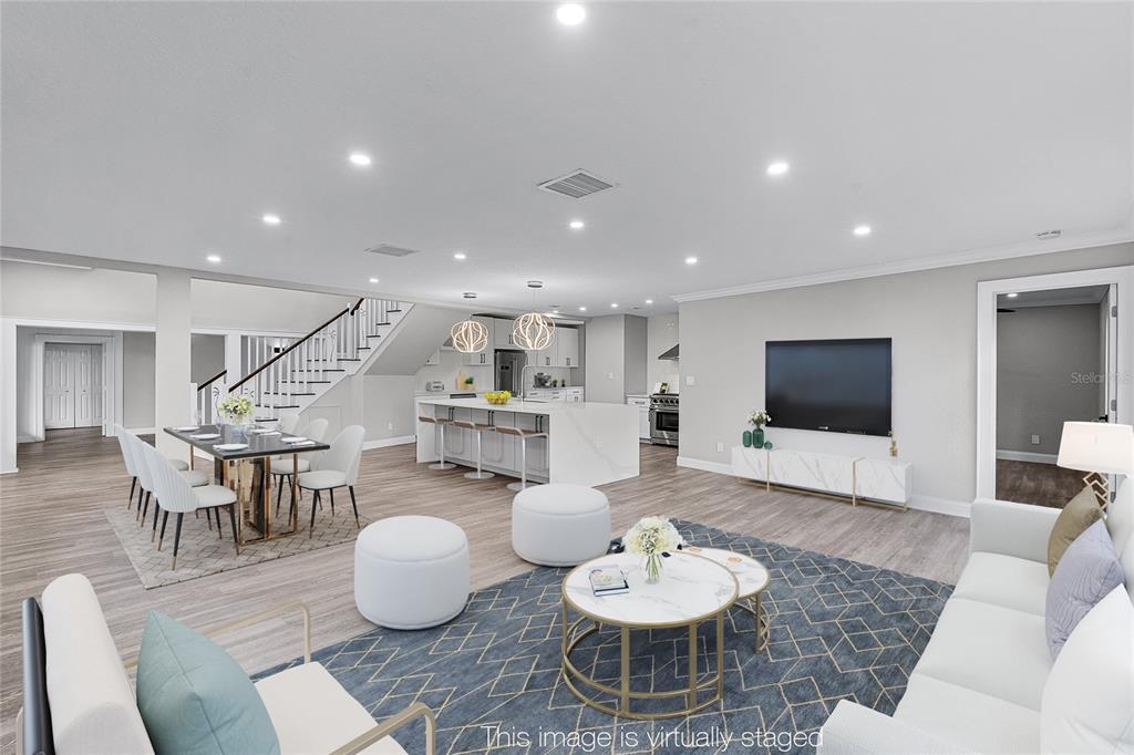 311 East 8th Avenue Windermere, FL 34786 - Photo 4 of 59 a living room with furniture and a flat screen tv