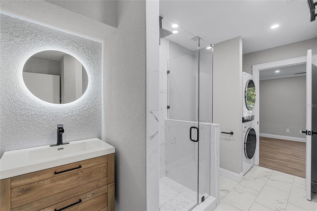 311 East 8th Avenue Windermere, FL 34786 - Photo 42 of 59 a bathroom with a toilet a sink and mirror