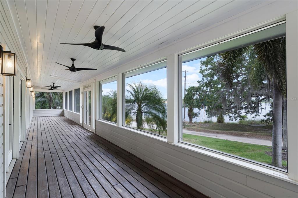 311 East 8th Avenue Windermere, FL 34786 - Photo 47 of 59 a view of a porch with wooden floor and outdoor space