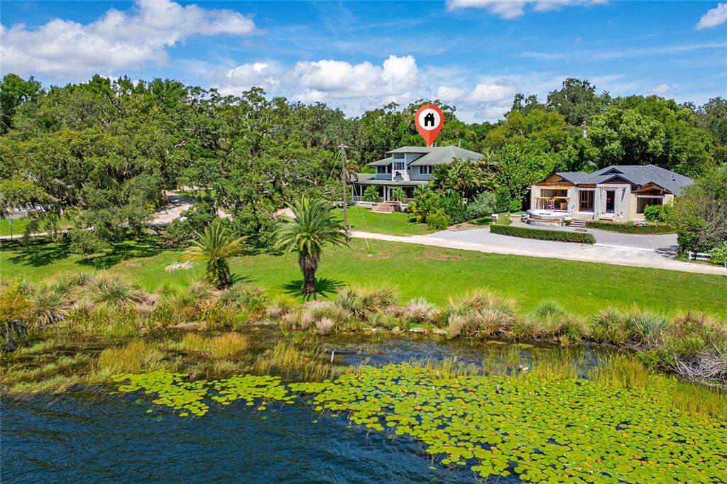 311 East 8th Avenue Windermere, FL 34786 - Photo 52 of 59 a front view of a house with a yard
