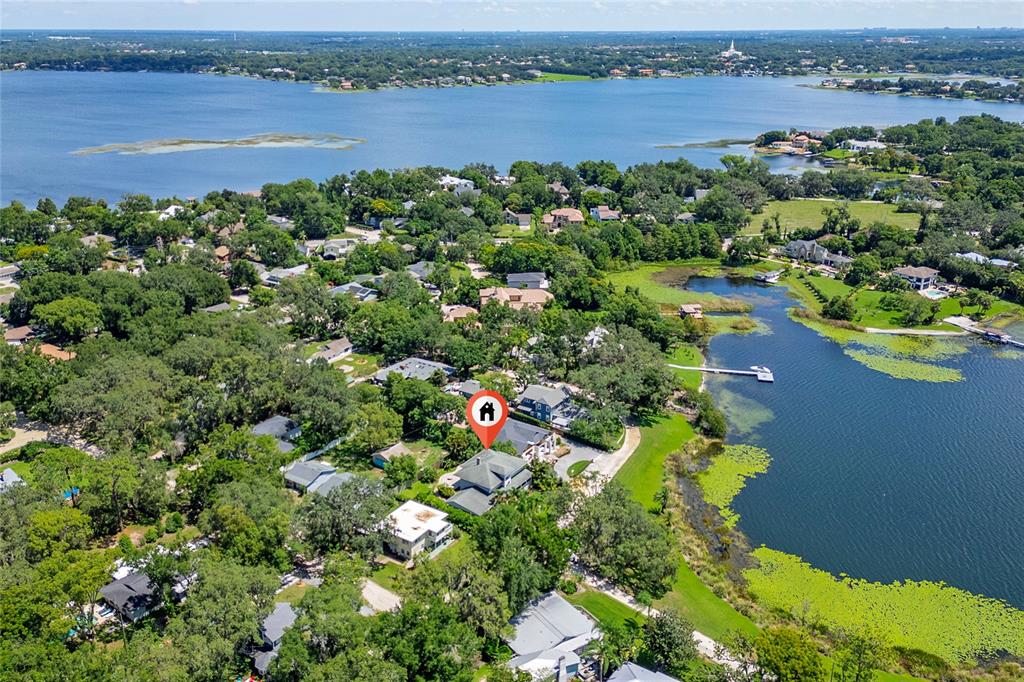 311 East 8th Avenue Windermere, FL 34786 - Photo 58 of 59 an aerial view of a houses with a lake view
