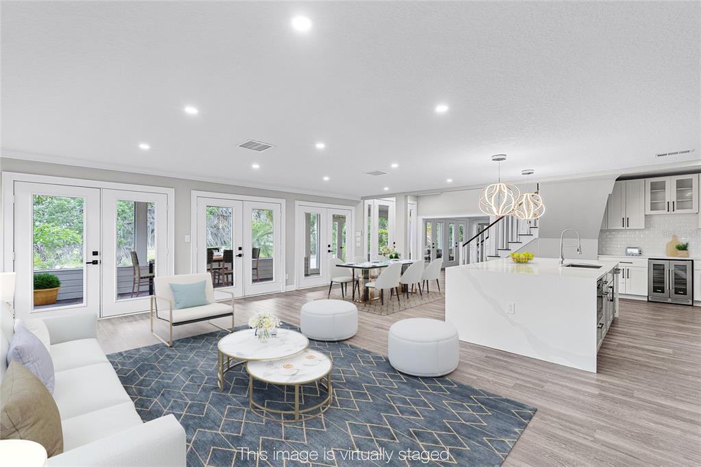 311 East 8th Avenue Windermere, FL 34786 - Photo 6 of 59 a living room with furniture and wooden floor