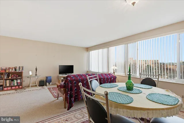 a living room with furniture and flat screen tv