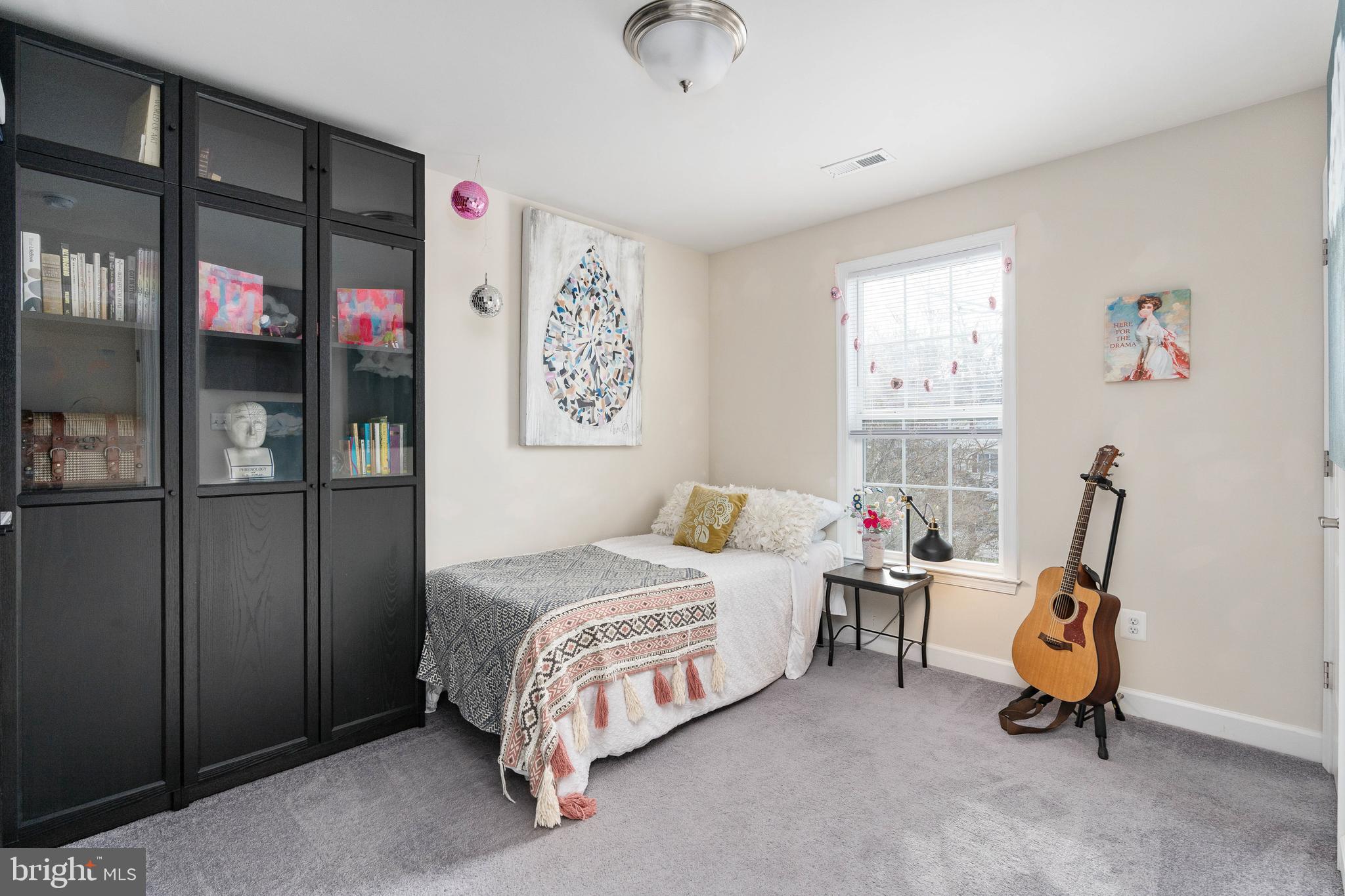 109 12th Street Colonial Beach, VA 22443 - Photo 20 of 33 a bedroom with a bed and a window