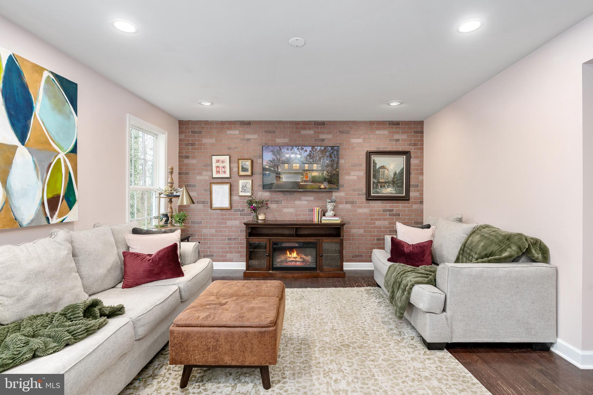 109 12th Street Colonial Beach, VA 22443 - Photo 22 of 33 a living room with furniture and a fireplace