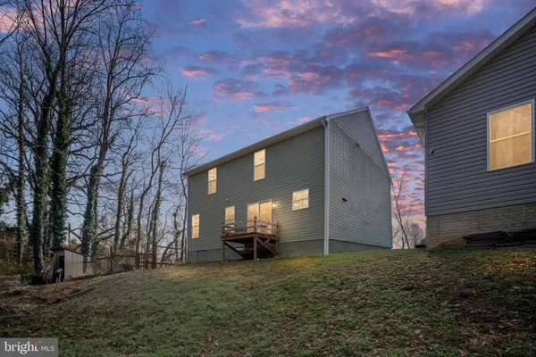 a view of a house with a back yard