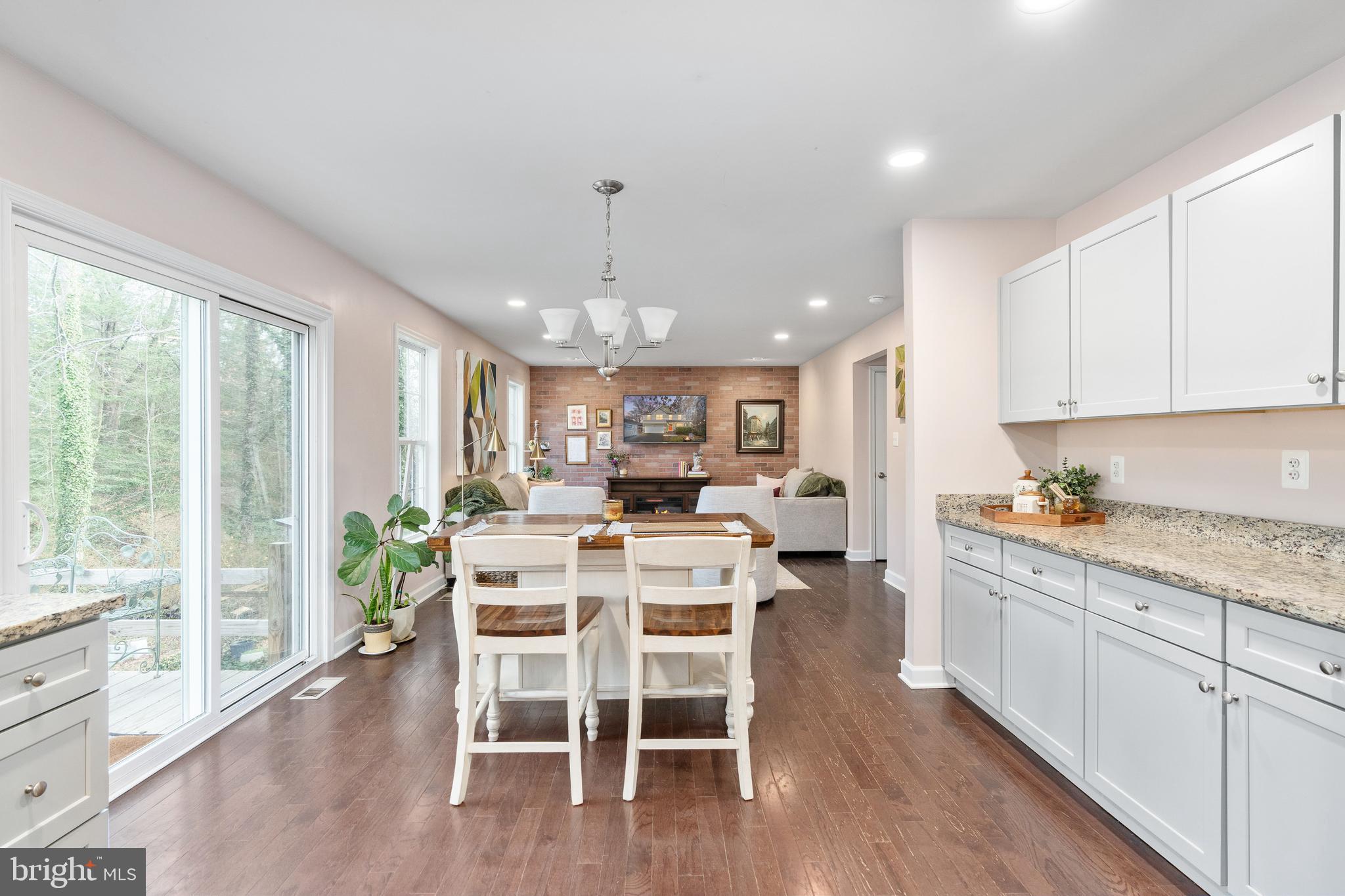 109 12th Street Colonial Beach, VA 22443 - Photo 5 of 33 a view of a dining room with furniture window and wooden floor