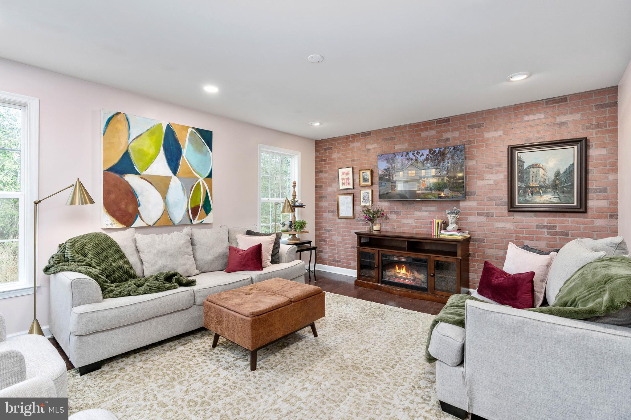 109 12th Street Colonial Beach, VA 22443 - Photo 7 of 33 a living room with furniture and a flat screen tv