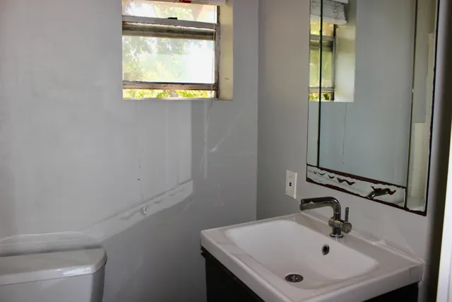 a bathroom with a sink and a mirror