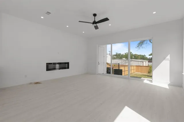 a large kitchen with stainless steel appliances kitchen island a large counter top and a stove