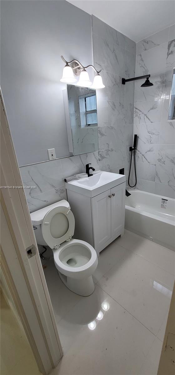 11275 Northwest 17th Avenue Miami, FL 33167 - Photo 15 of 21 a bathroom with a toilet a sink and mirror