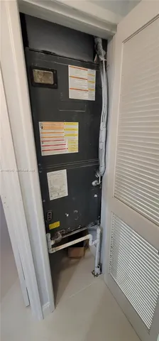 a view of a refrigerator in kitchen and entryway