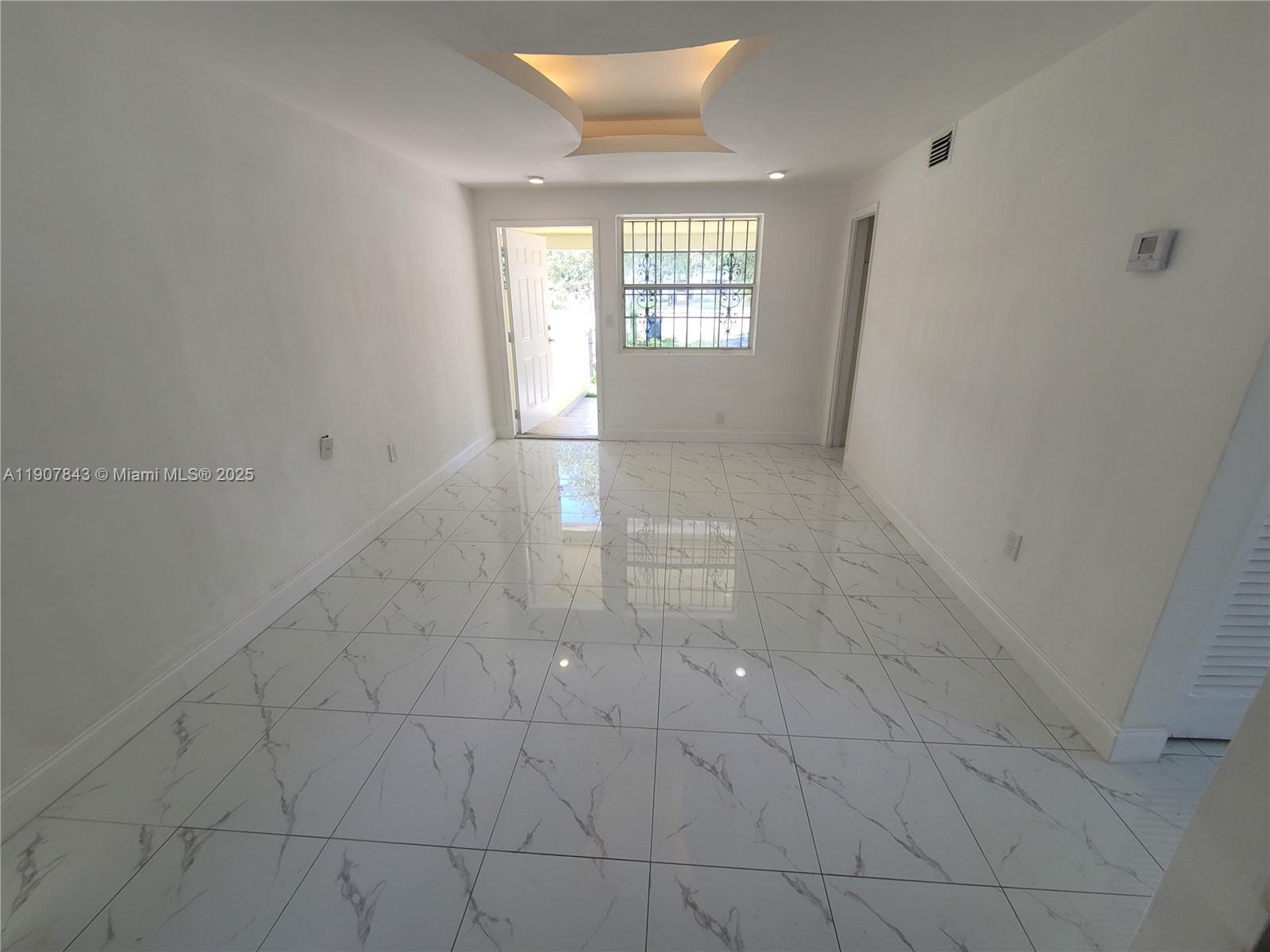 11275 Northwest 17th Avenue Miami, FL 33167 - Photo 21 of 21 en empty room with windows