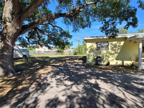 a view of a house with a tree