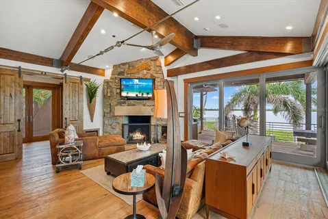 a living room with furniture and a dresser