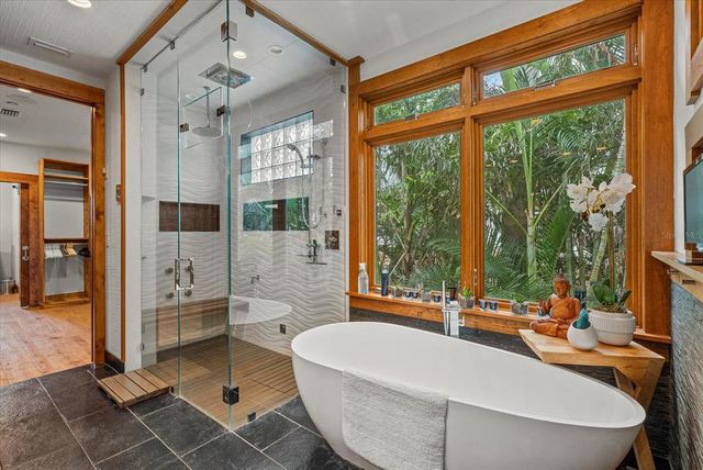 a view of a chairs and table in the balcony