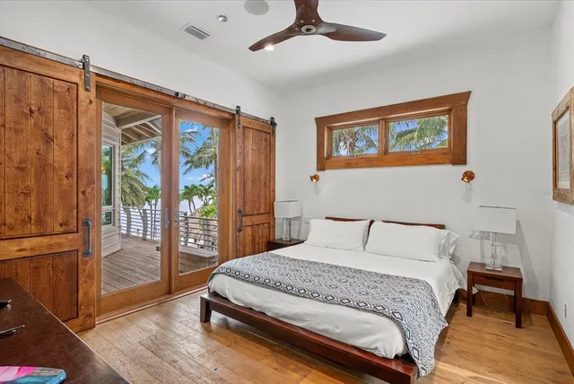 a bed room with a bed and a large window