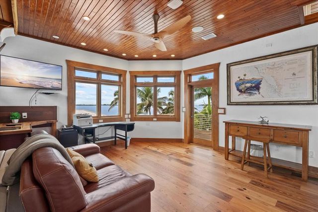 a room with a washing machine and a mirror