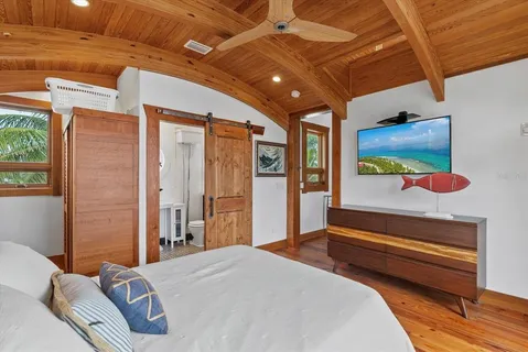 a kitchen with a stove a table and chairs in it