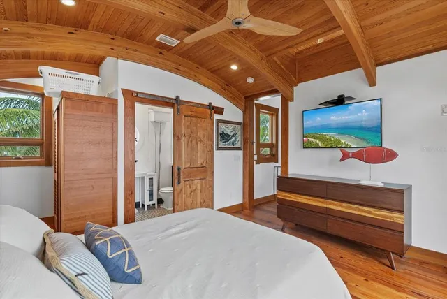 a kitchen with a stove a table and chairs in it