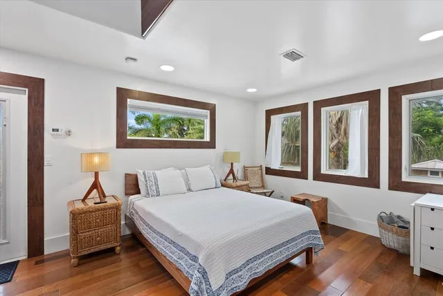 a view of a house with a patio and a yard