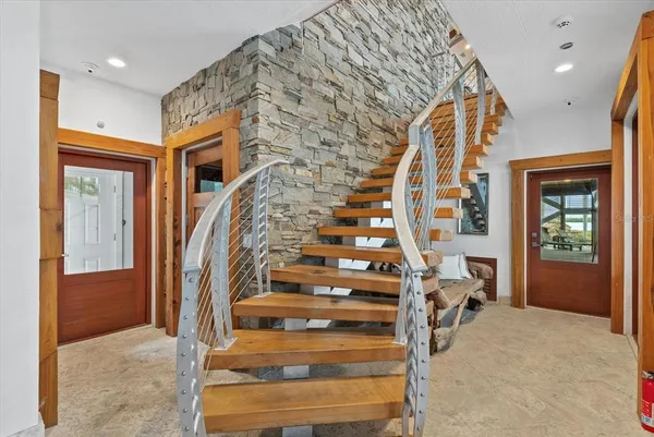 a view of a dining room with furniture wooden floor and a chandelier