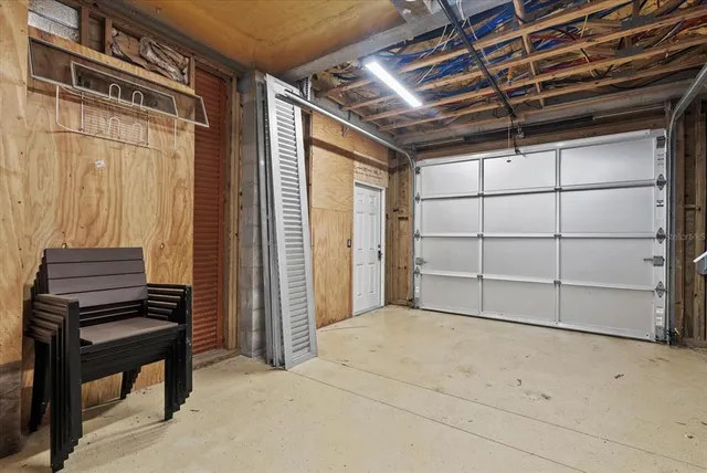 a view of a backyard with table and chairs and potted plants