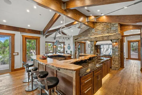 a living room with lots of furniture and a large window