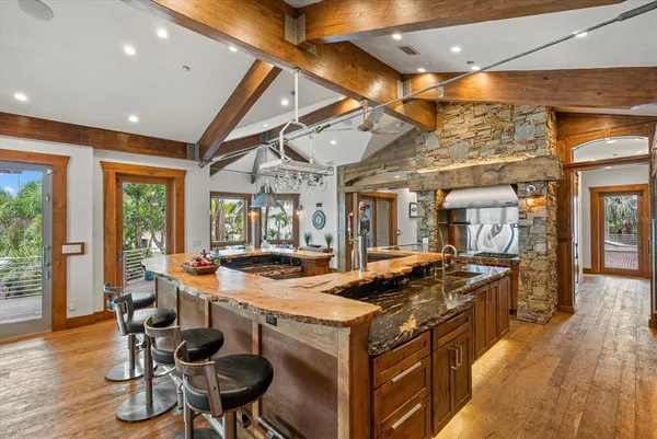 a living room with lots of furniture and a large window