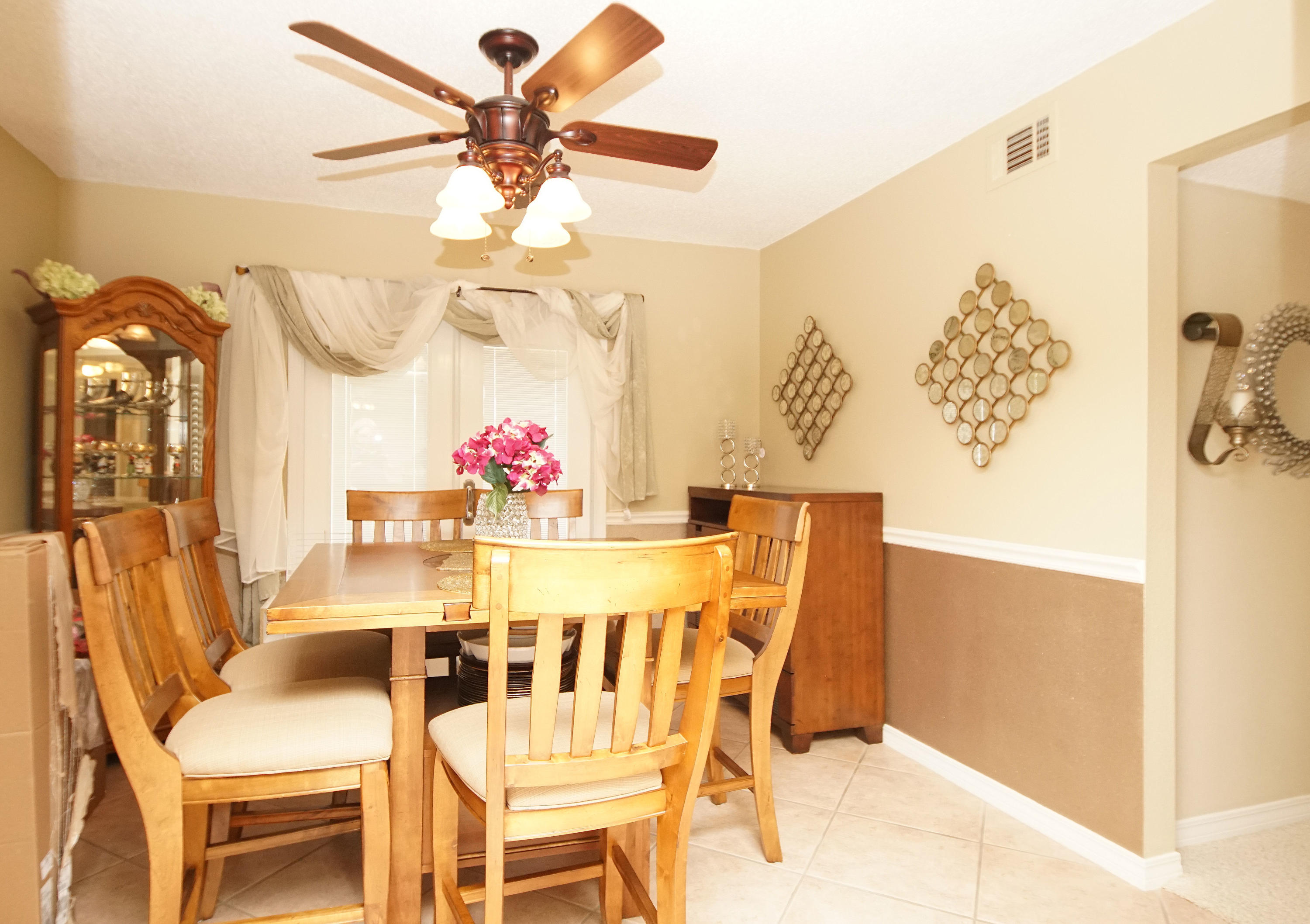 467 Sandy Ridge Circle Mary Esther, FL 32569 - Photo 11 of 37 a view of a dining room with furniture and chandelier