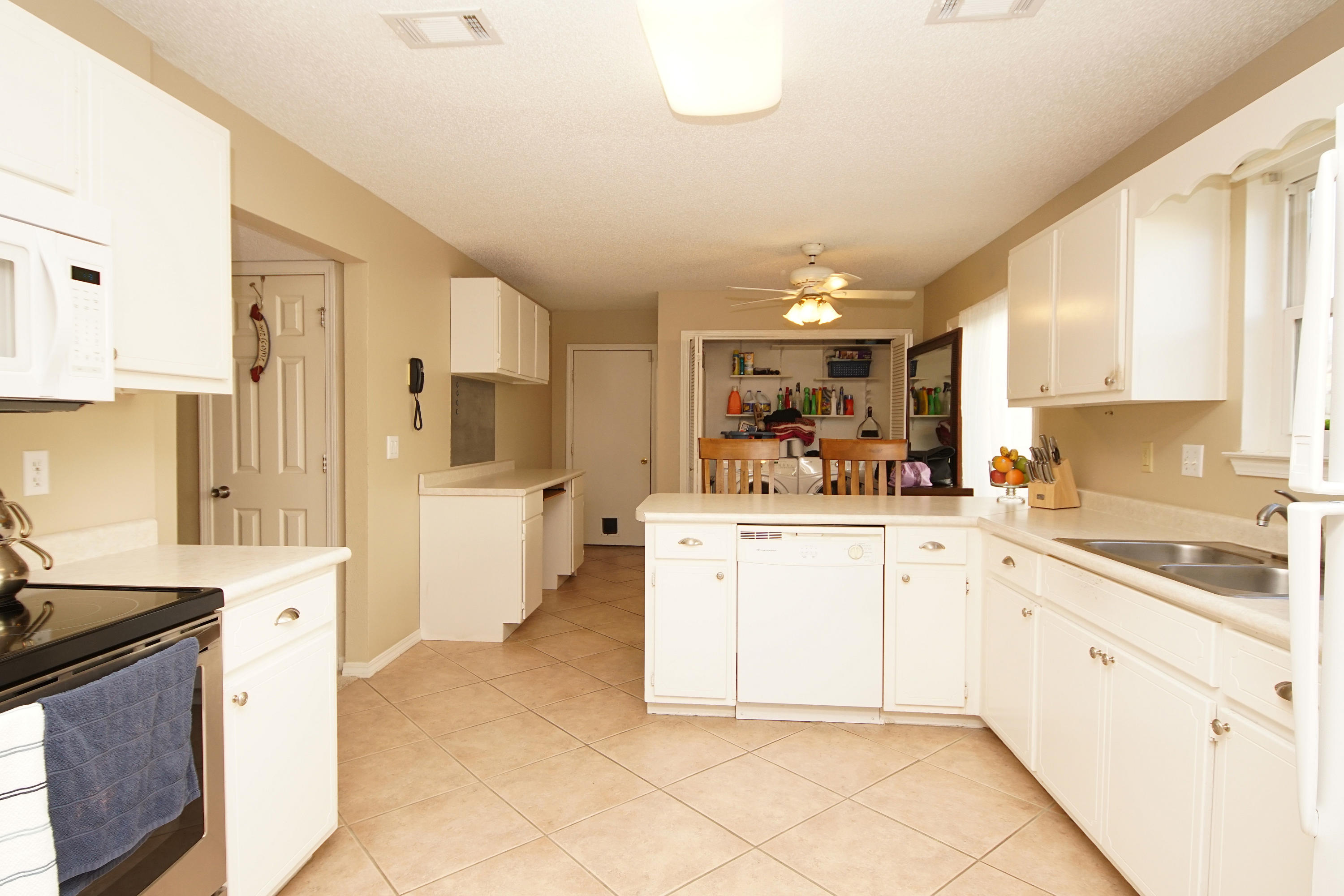 467 Sandy Ridge Circle Mary Esther, FL 32569 - Photo 12 of 37 a kitchen with a sink and cabinets