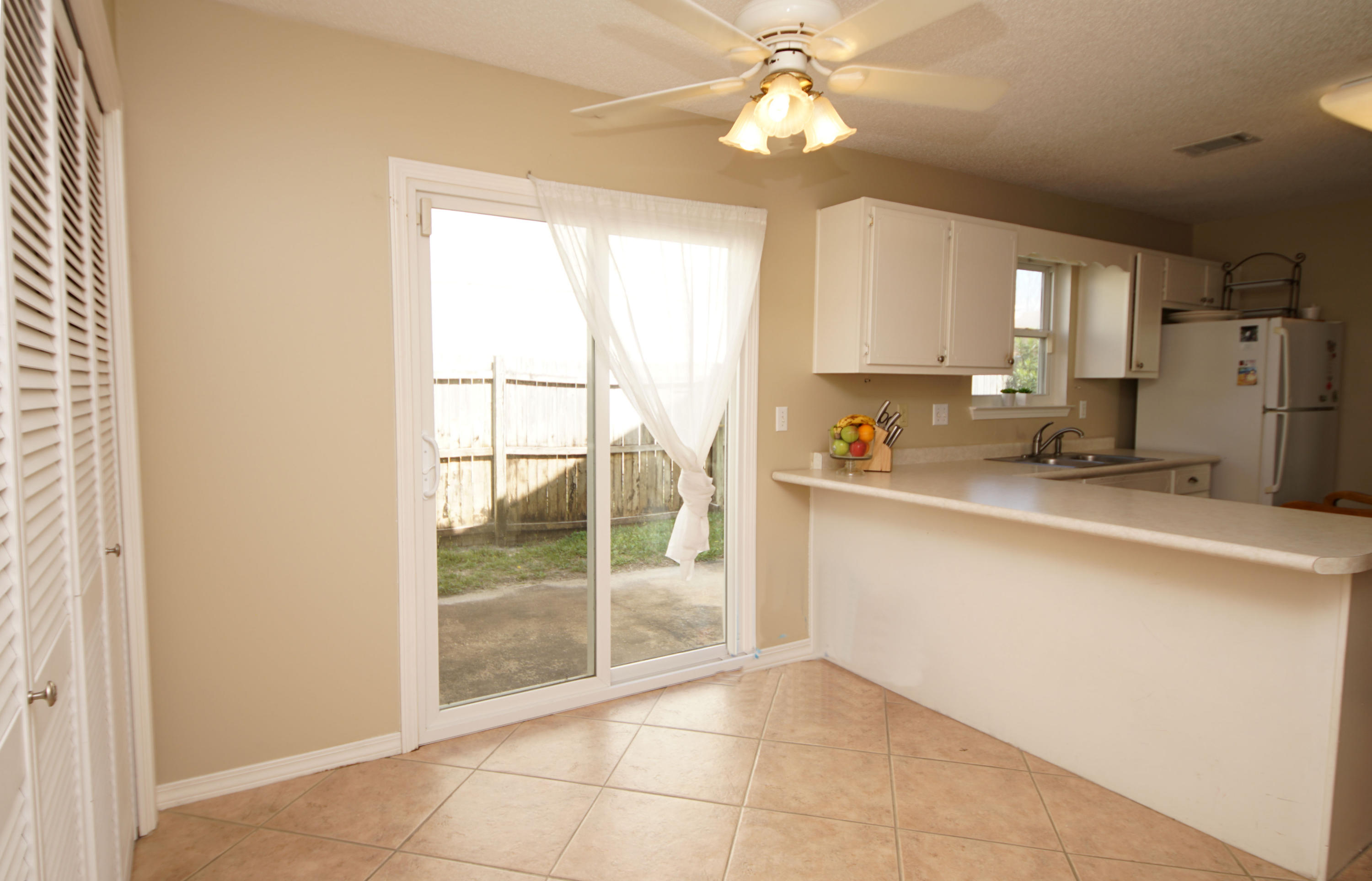467 Sandy Ridge Circle Mary Esther, FL 32569 - Photo 17 of 37 a kitchen with stainless steel appliances a sink a refrigerator and cabinets