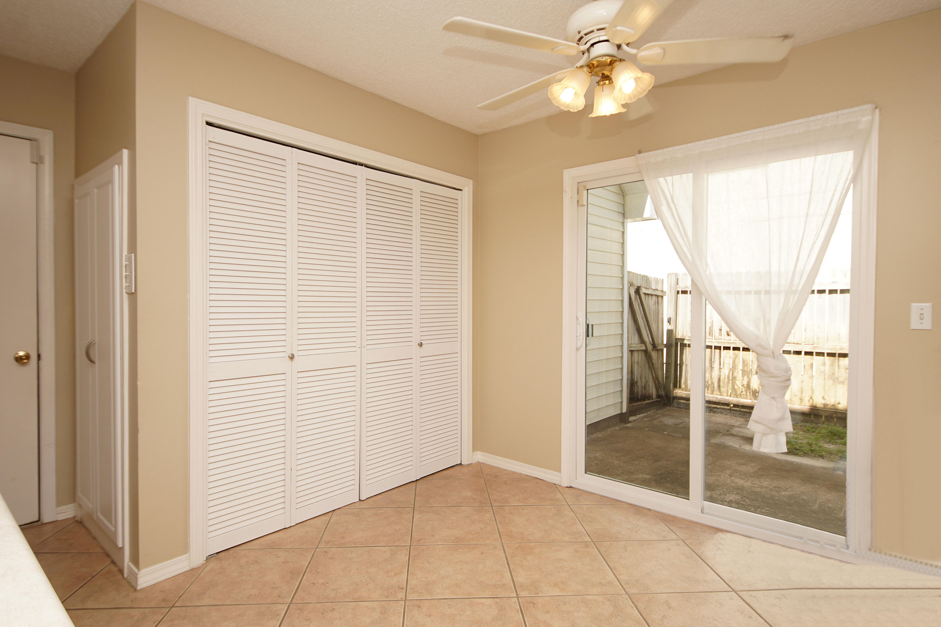 467 Sandy Ridge Circle Mary Esther, FL 32569 - Photo 18 of 37 a view of a livingroom with a ceiling fan and window