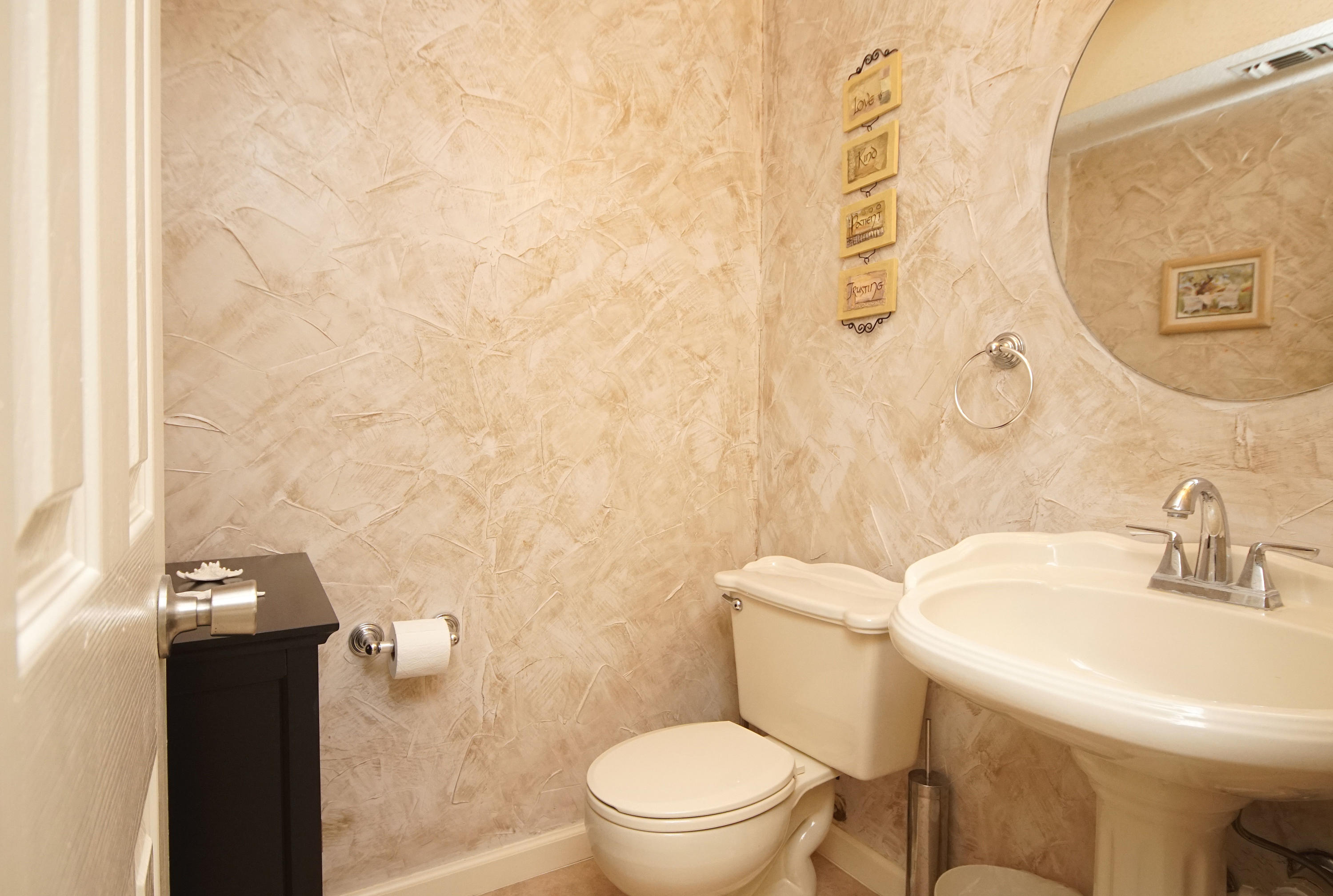 467 Sandy Ridge Circle Mary Esther, FL 32569 - Photo 22 of 37 a bathroom with a sink a toilet and a mirror