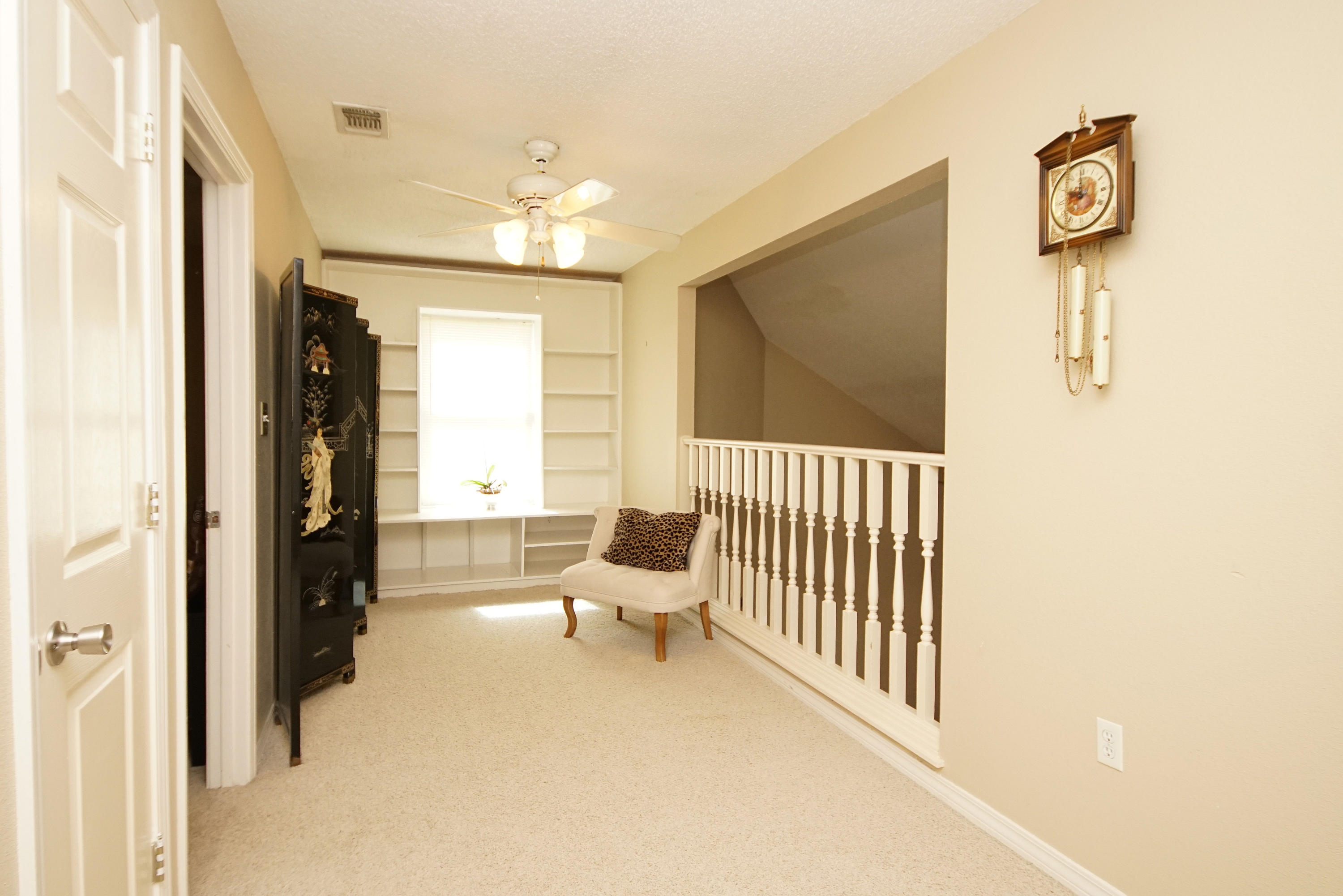 467 Sandy Ridge Circle Mary Esther, FL 32569 - Photo 25 of 37 a view of a hallway with couch and chandelier