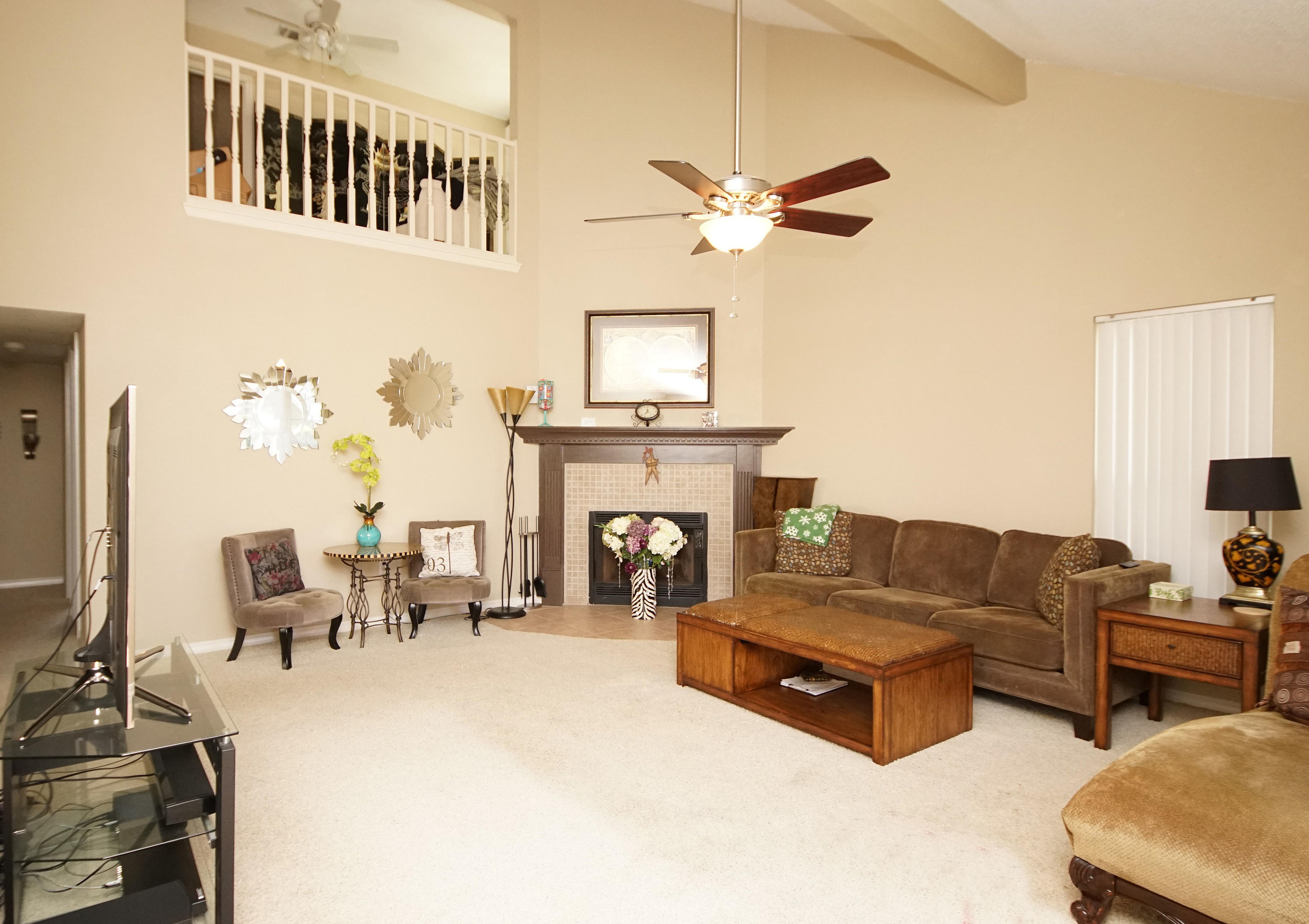 467 Sandy Ridge Circle Mary Esther, FL 32569 - Photo 8 of 37 a living room with furniture a fireplace and a flat screen tv
