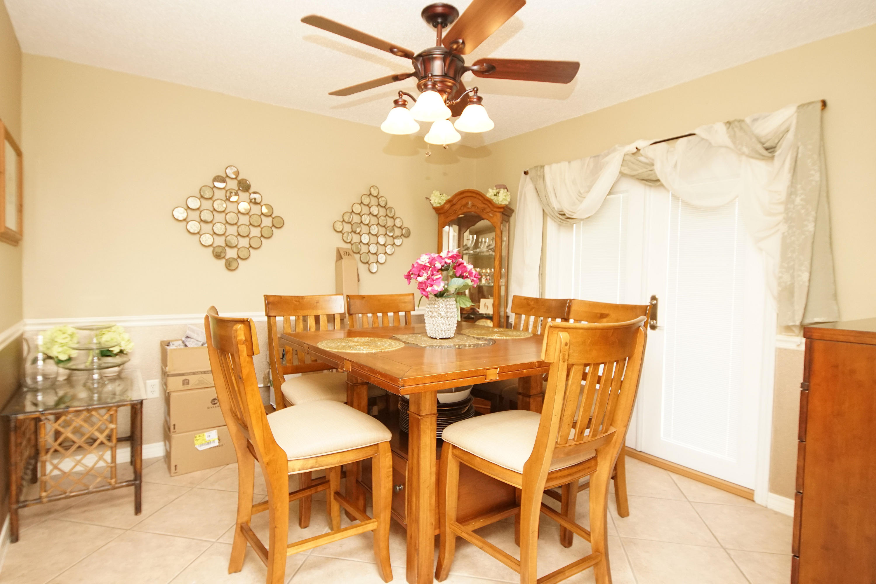 467 Sandy Ridge Circle Mary Esther, FL 32569 - Photo 10 of 37 a dining room with furniture and a chandelier