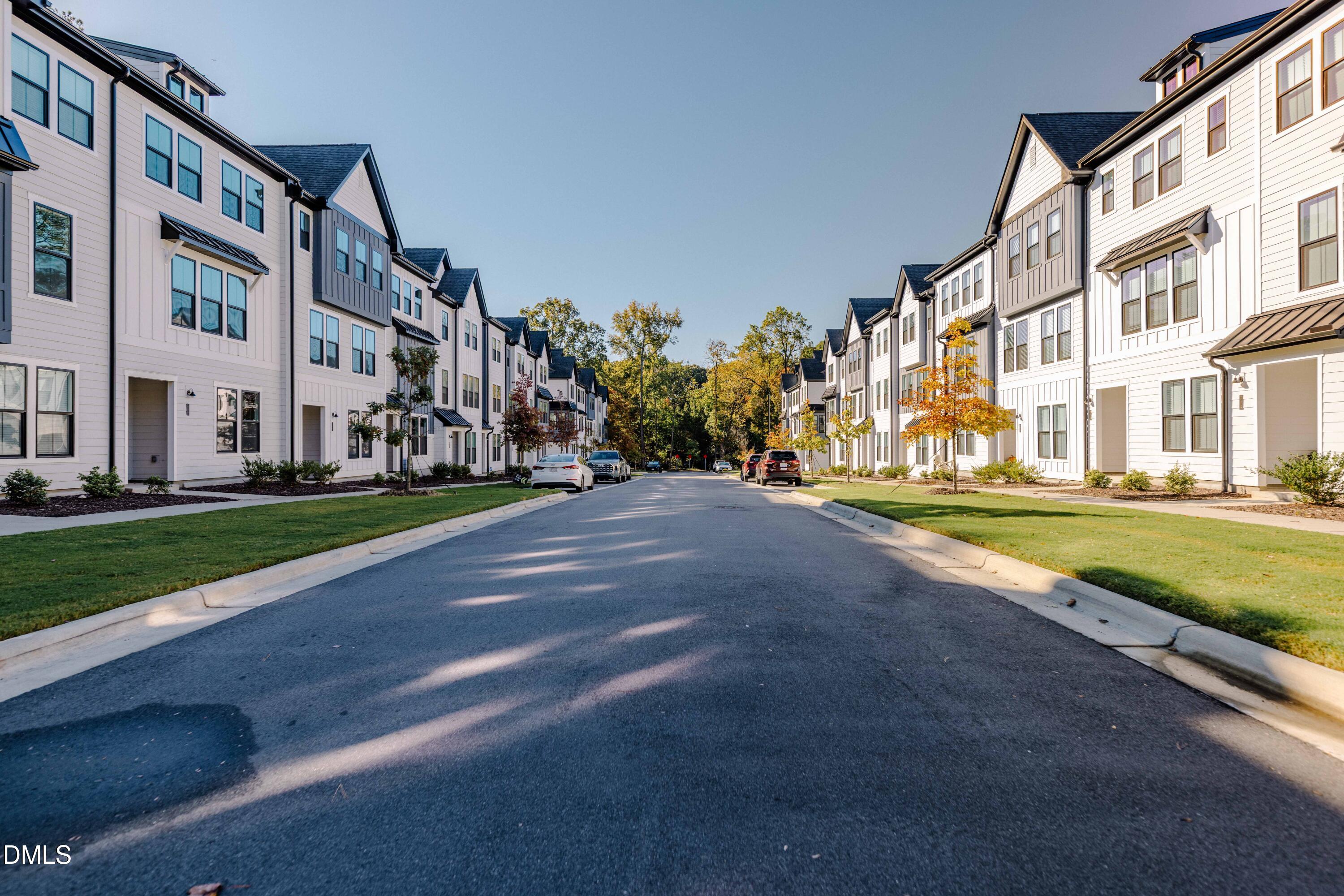 6420 Tanner Oak Lane Raleigh, NC 27613 - Photo 32 of 49 a view of a big building with a big yard and large trees