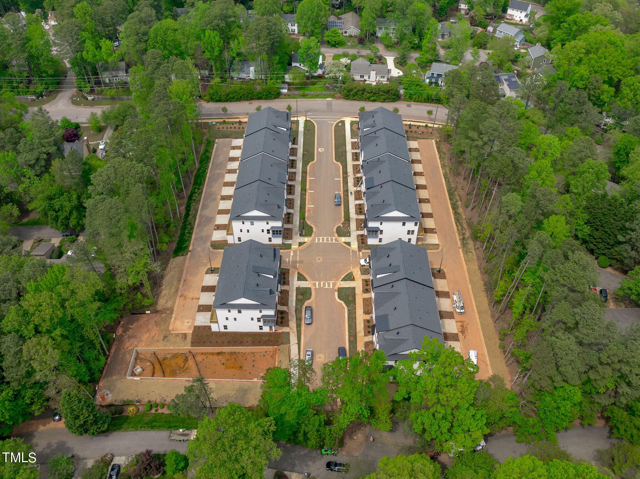 6420 Tanner Oak Lane Raleigh, NC 27613 - Photo 39 of 50 an aerial view of a residential apartment building with a yard