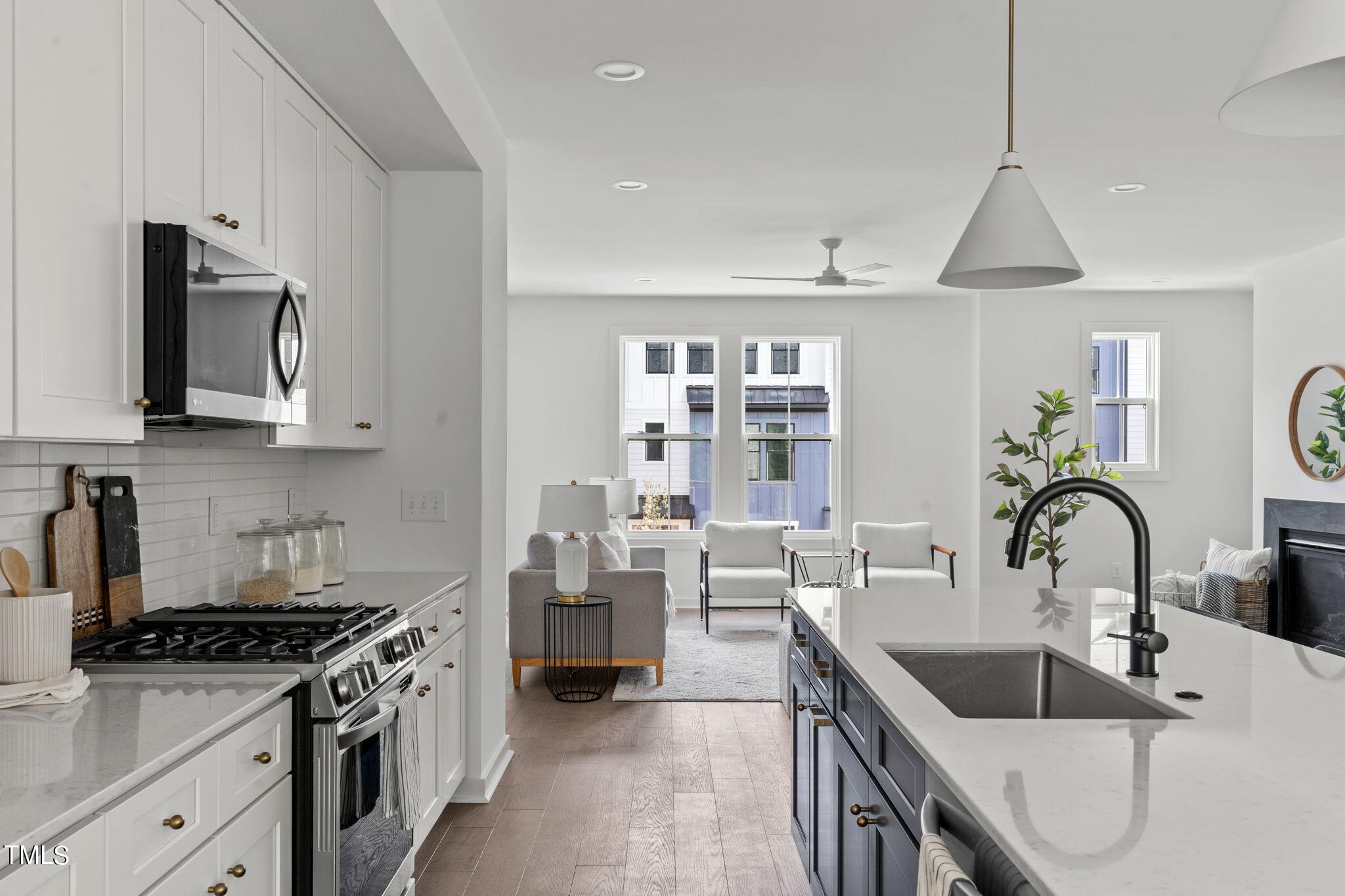 6420 Tanner Oak Lane Raleigh, NC 27613 - Photo 4 of 50 a kitchen with stainless steel appliances a sink stove and cabinets