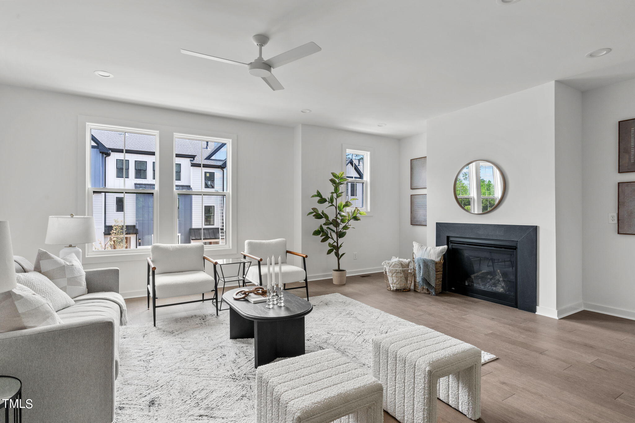 6420 Tanner Oak Lane Raleigh, NC 27613 - Photo 5 of 49 a living room with furniture a fireplace and a window