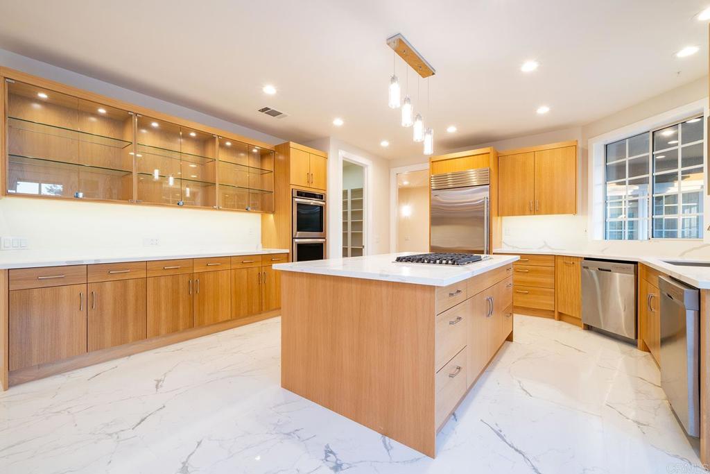 41965 Mesa Verdugo Temecula, CA 92592 - Photo 32 of 68 a large kitchen with stainless steel appliances granite countertop a large counter top and a stove