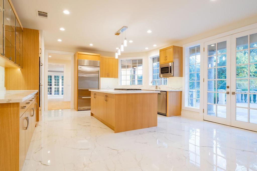 41965 Mesa Verdugo Temecula, CA 92592 - Photo 34 of 68 a large white kitchen with a large window